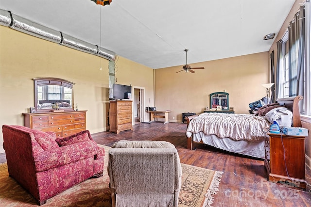 bedroom with ceiling fan and dark hardwood / wood-style floors