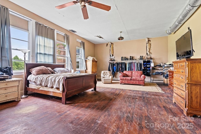 bedroom featuring dark hardwood / wood-style floors and ceiling fan