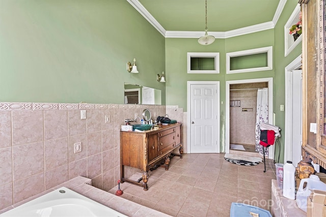 bathroom with tile patterned floors, ornamental molding, independent shower and bath, and tile walls