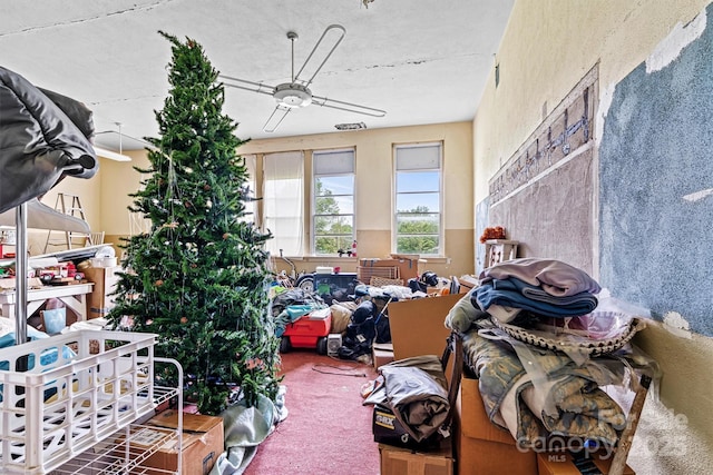 misc room with ceiling fan and carpet flooring