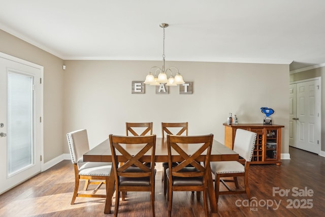 dining area with crown molding, dark hardwood / wood-style floors, and a notable chandelier