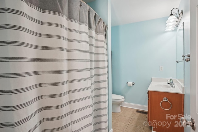 bathroom with vanity, toilet, curtained shower, and tile patterned flooring