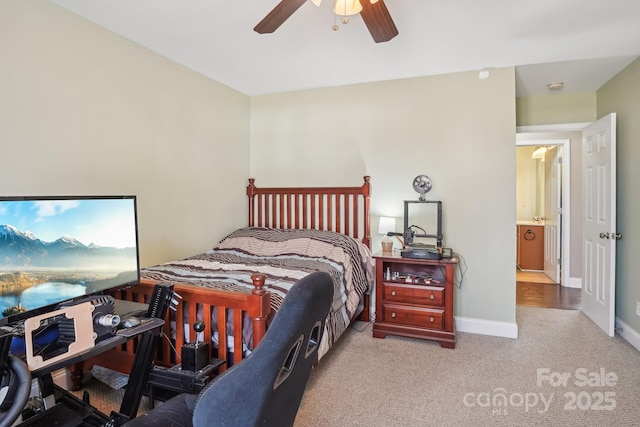 bedroom with ceiling fan and light colored carpet