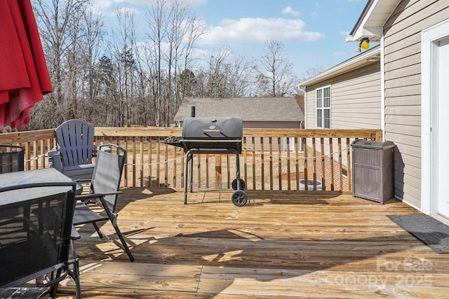 wooden deck with area for grilling