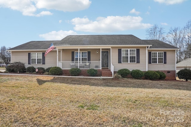 ranch-style home featuring a porch and a front lawn