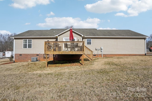 rear view of property with a wooden deck, central AC, and a lawn