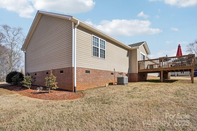 view of property exterior with a wooden deck, a lawn, and central air condition unit