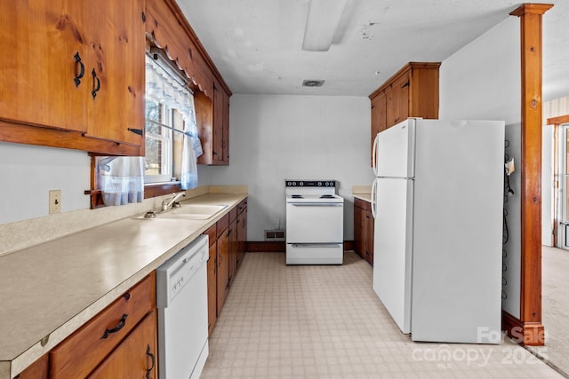 kitchen with sink and white appliances