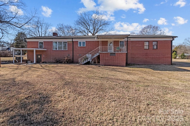 back of house with a yard