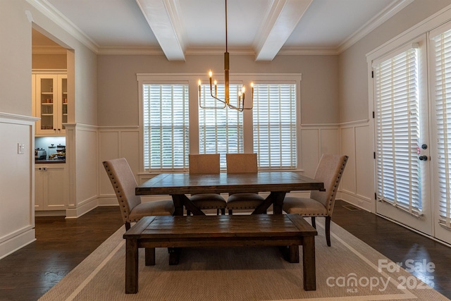 dining area with crown molding, beam ceiling, dark hardwood / wood-style floors, and a chandelier