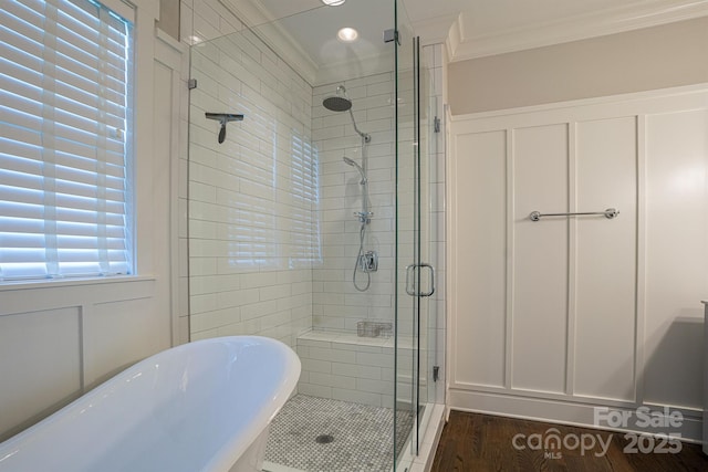 bathroom with ornamental molding and plus walk in shower