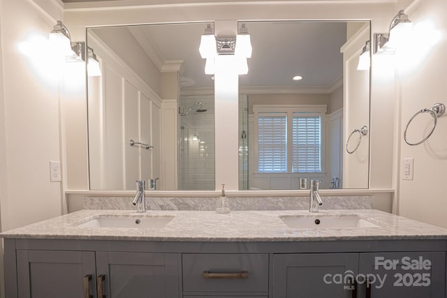 bathroom featuring vanity, crown molding, and tiled shower