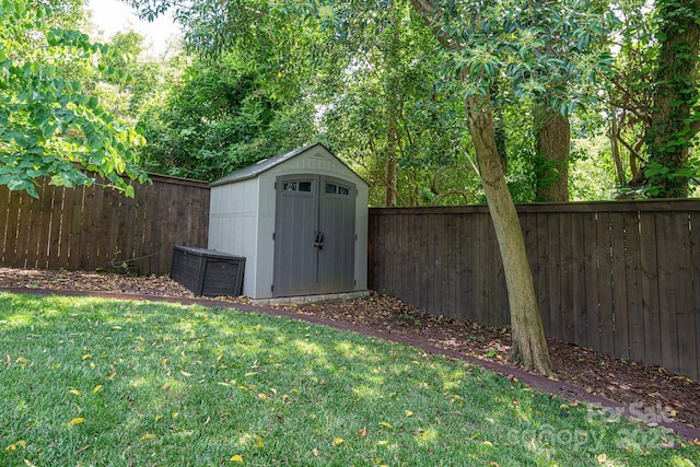 view of outdoor structure with a lawn