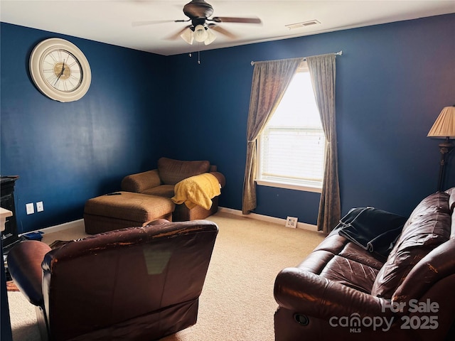 living room featuring ceiling fan and light carpet