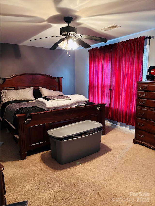 bedroom with light colored carpet and ceiling fan