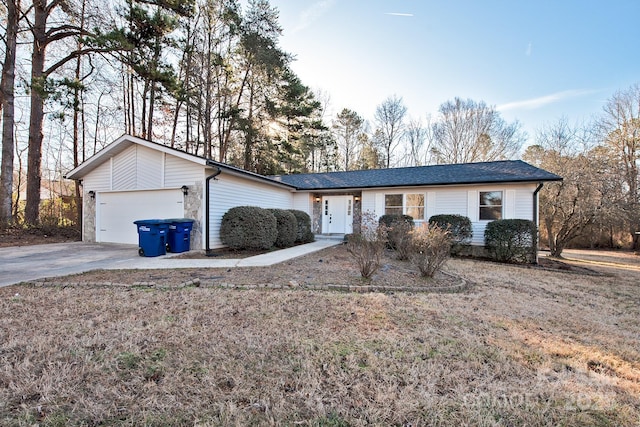 ranch-style home featuring a garage