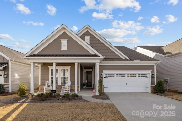 craftsman-style house with covered porch and a garage