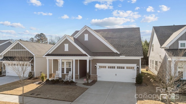 view of front of house with covered porch and a garage