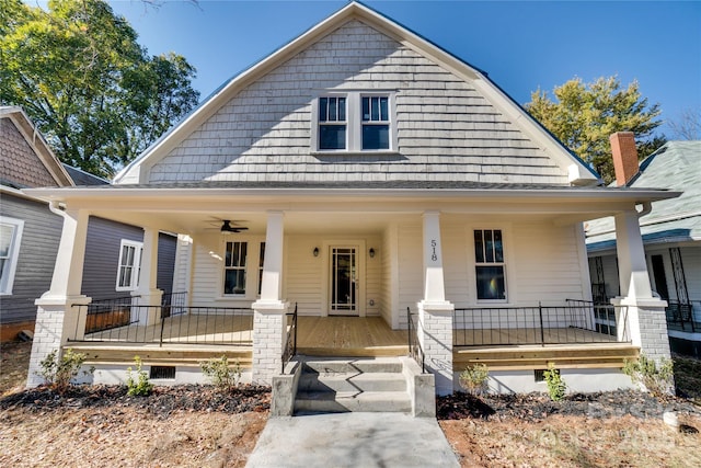 view of front of house with ceiling fan and a porch