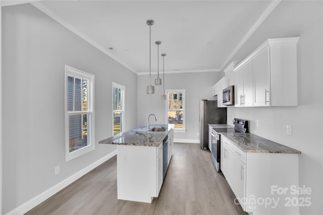 kitchen featuring sink, white cabinetry, hanging light fixtures, stainless steel appliances, and a center island with sink