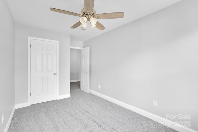 unfurnished bedroom with carpet floors and ceiling fan