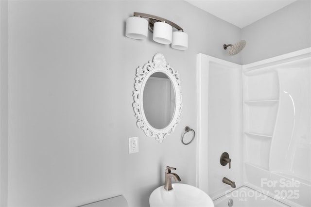 bathroom with shower / washtub combination