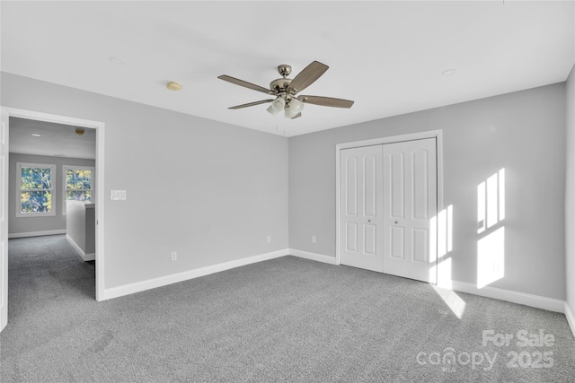 empty room with carpet and ceiling fan