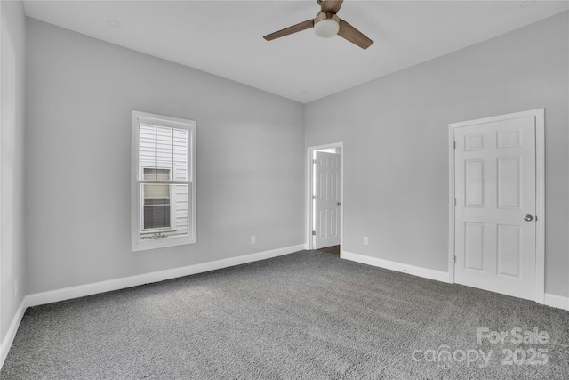 spare room featuring carpet and ceiling fan