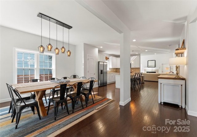 dining room featuring dark hardwood / wood-style flooring