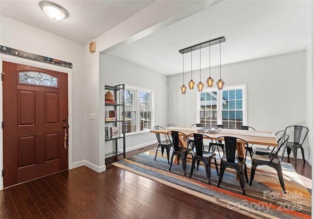 entryway with dark hardwood / wood-style flooring