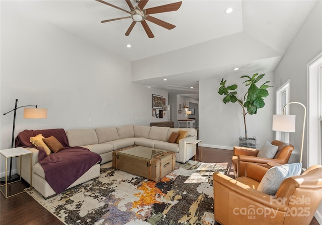 living room featuring dark hardwood / wood-style floors and ceiling fan