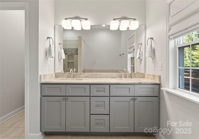 bathroom featuring tile patterned floors, vanity, and a shower