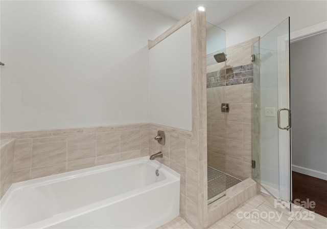 bathroom featuring tile patterned flooring and plus walk in shower