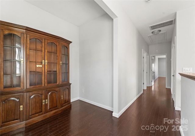 corridor with dark wood-type flooring