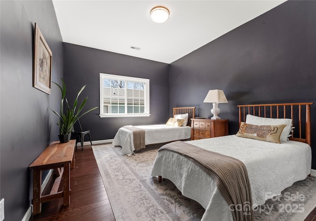 bedroom with hardwood / wood-style floors