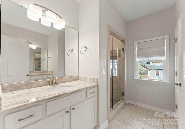 bathroom featuring tile patterned flooring, vanity, and a shower with shower door