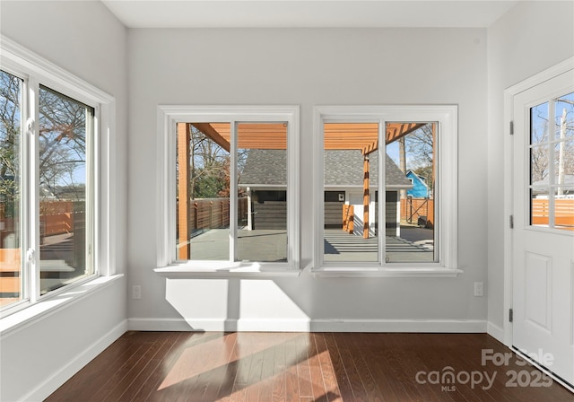 entryway with dark hardwood / wood-style flooring