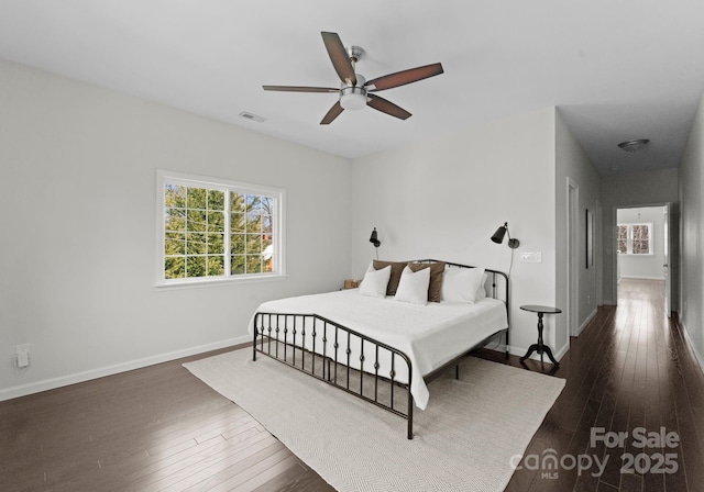 bedroom featuring dark wood-type flooring and ceiling fan