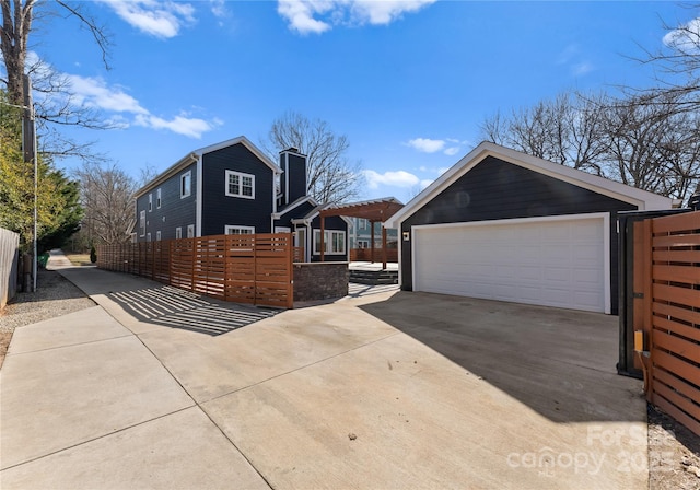 view of property exterior featuring an outbuilding and a garage