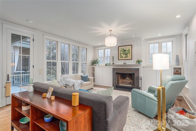 living room with a healthy amount of sunlight and light wood-type flooring