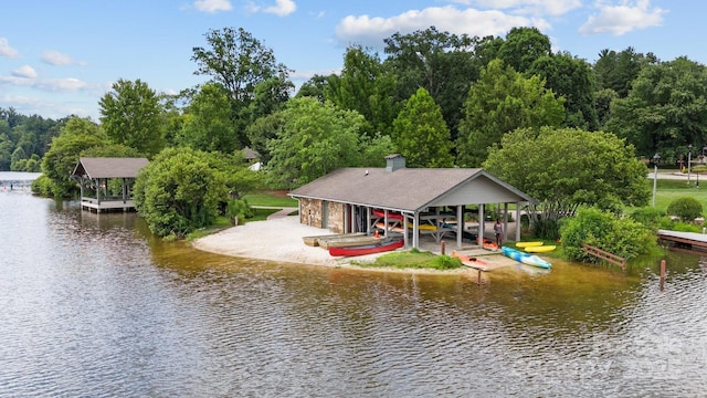 rear view of property featuring a water view