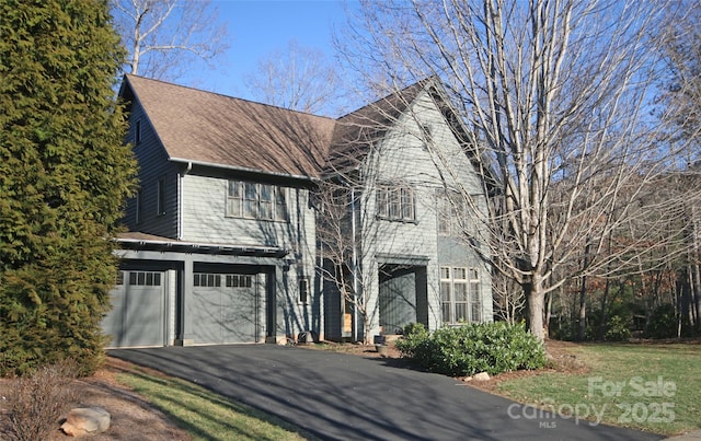 view of front of house featuring a garage and driveway