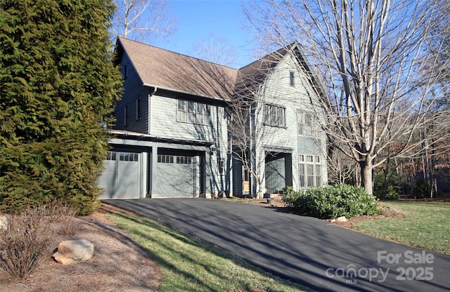 view of front of house featuring a garage and driveway