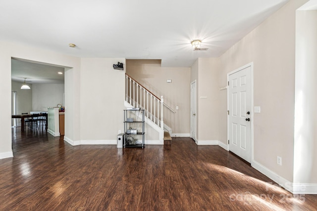 foyer with dark hardwood / wood-style flooring