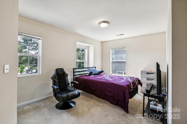 bedroom with light carpet