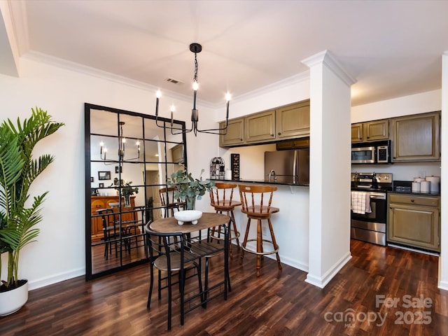 dining space featuring a notable chandelier, crown molding, and dark hardwood / wood-style floors