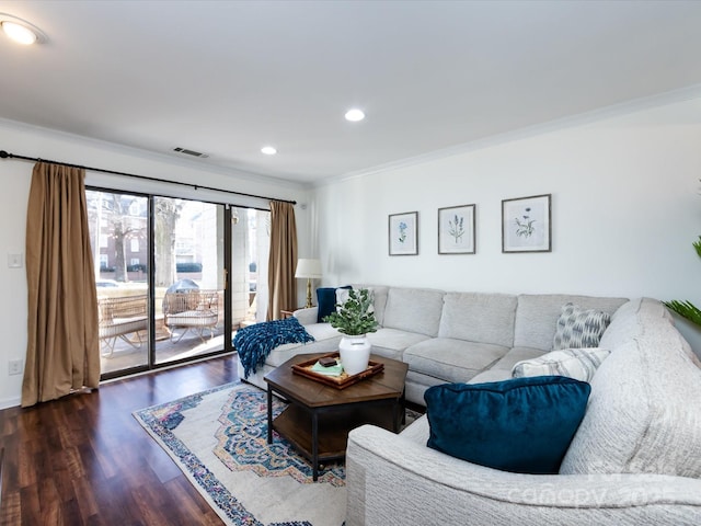 living room featuring crown molding and dark hardwood / wood-style flooring