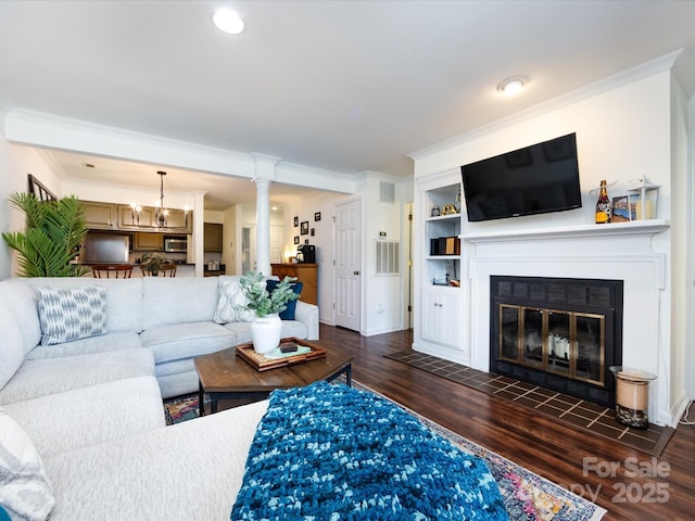 living room featuring ornamental molding and dark wood-type flooring