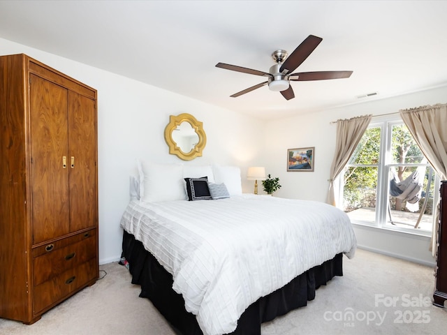 carpeted bedroom with ceiling fan