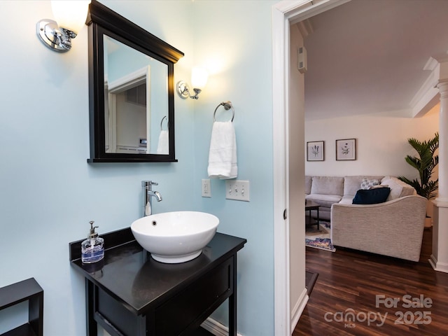 bathroom featuring hardwood / wood-style flooring and vanity